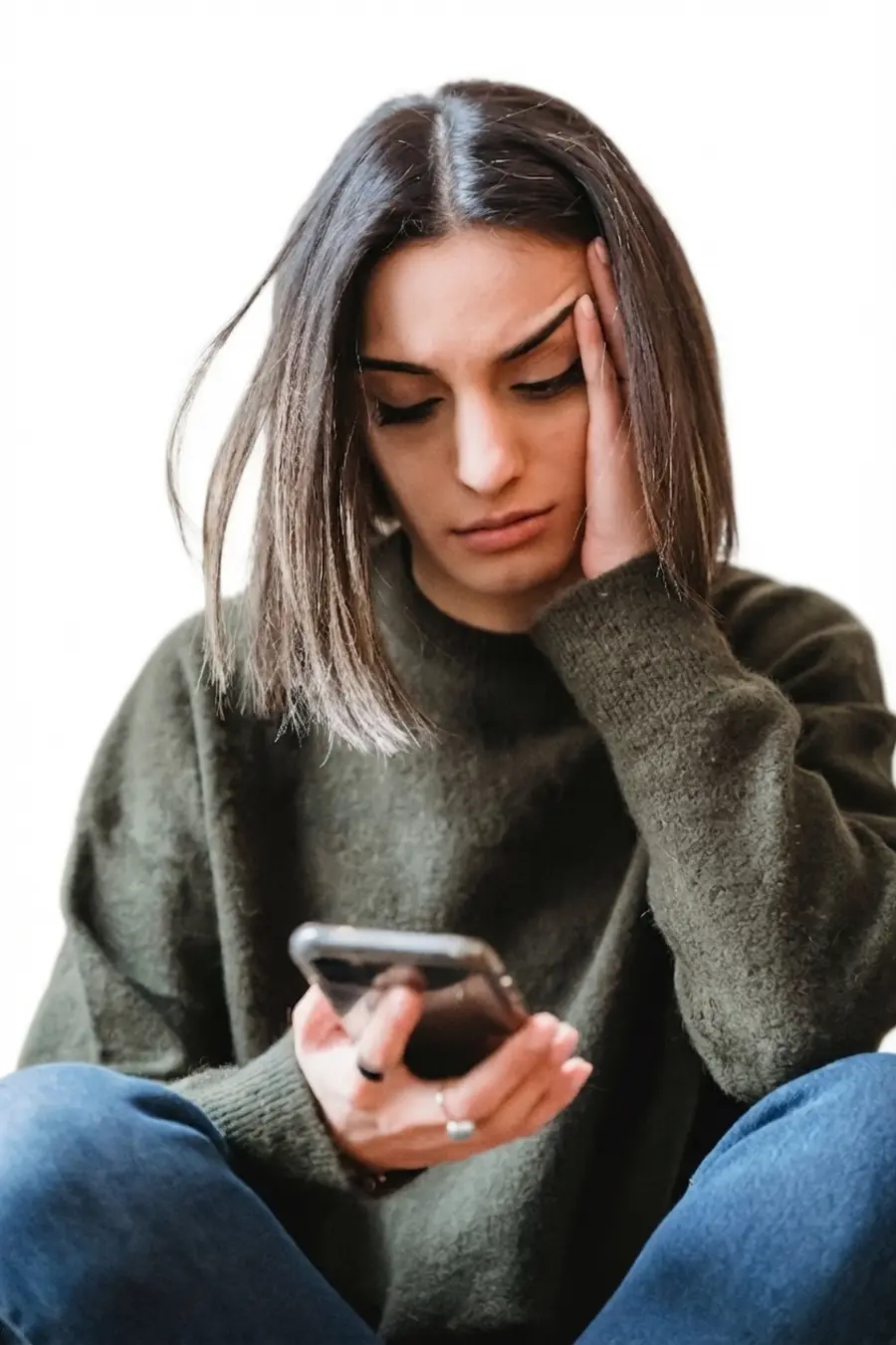 A shop owner looking at her phone
